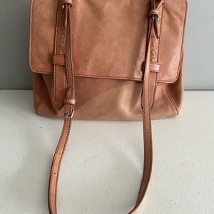 Nice pinkish/tan leather Frye bag with water stain at bottom.